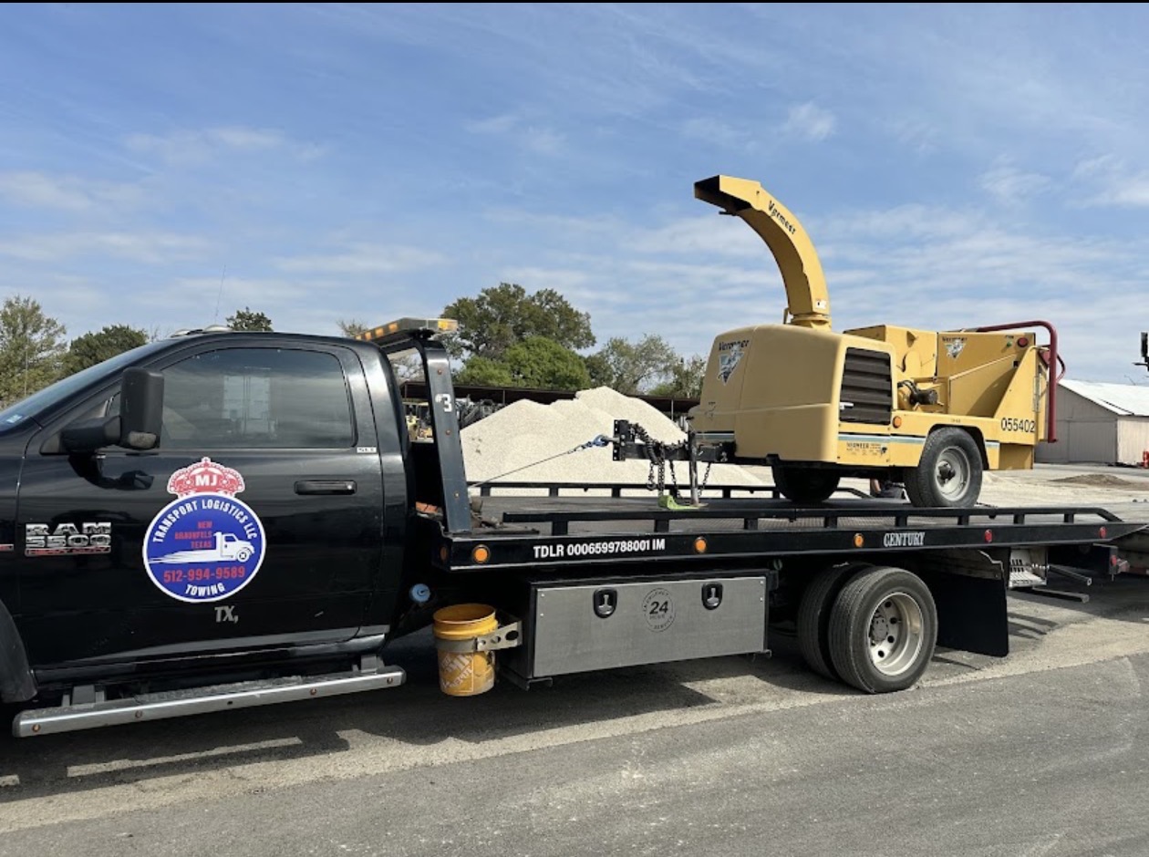 Heavy equipment towed by MJ Transport in New Braunfels