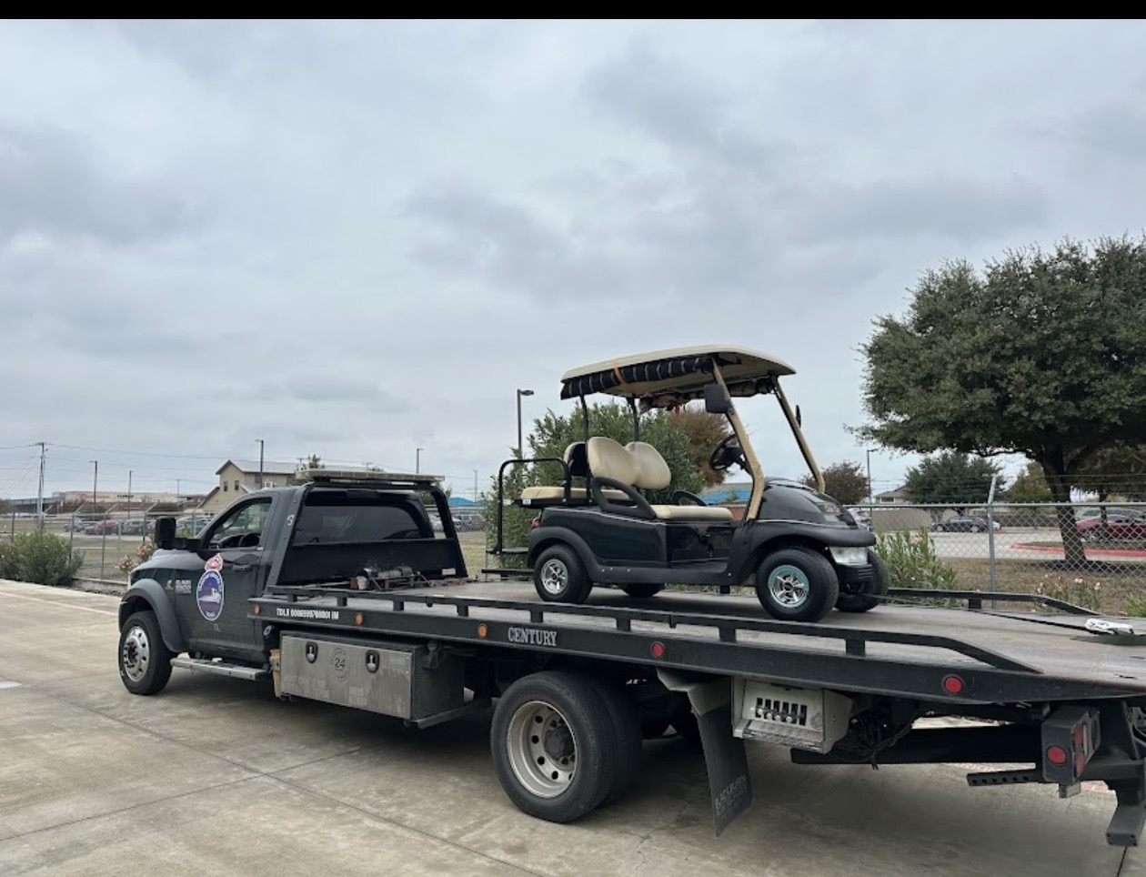 Golf cart loaded on MJ Transport flatbed rollback