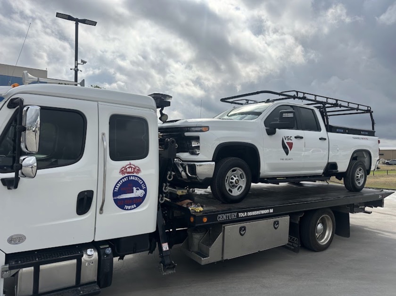 Commercial truck loaded on MJ Transport flatbed